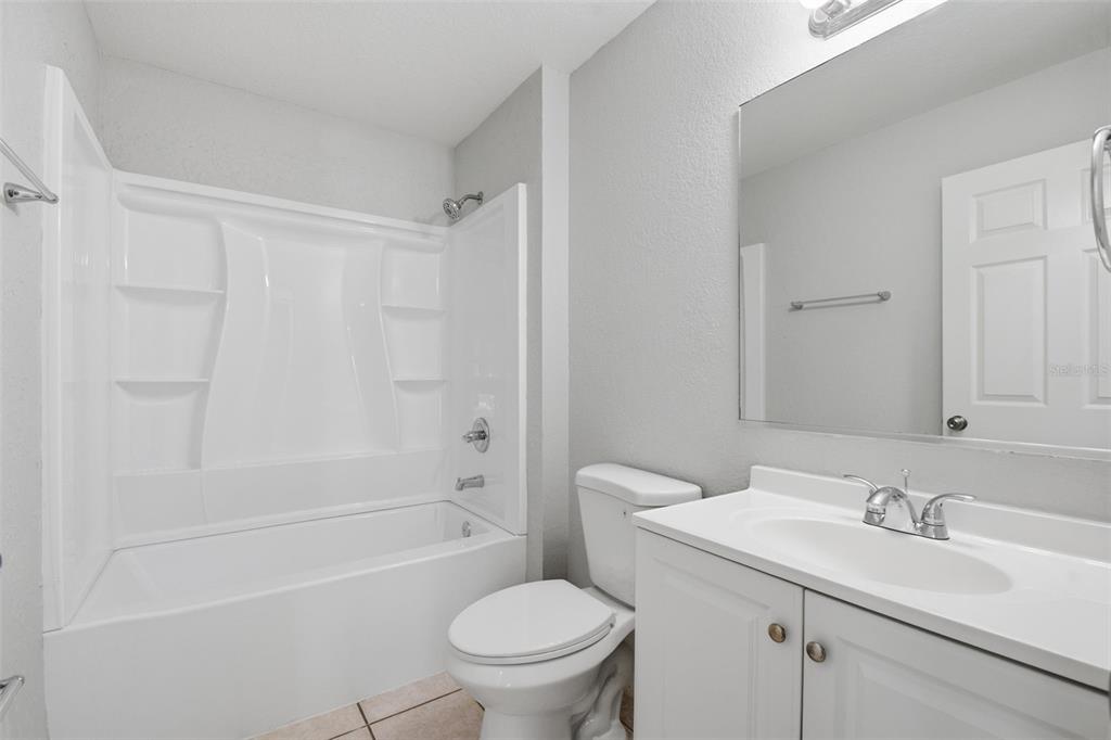 6018 Flora Terrace Apollo Beach, FL 33572 - Photo 25 of 33 a bathroom with a sink toilet vanity and shower