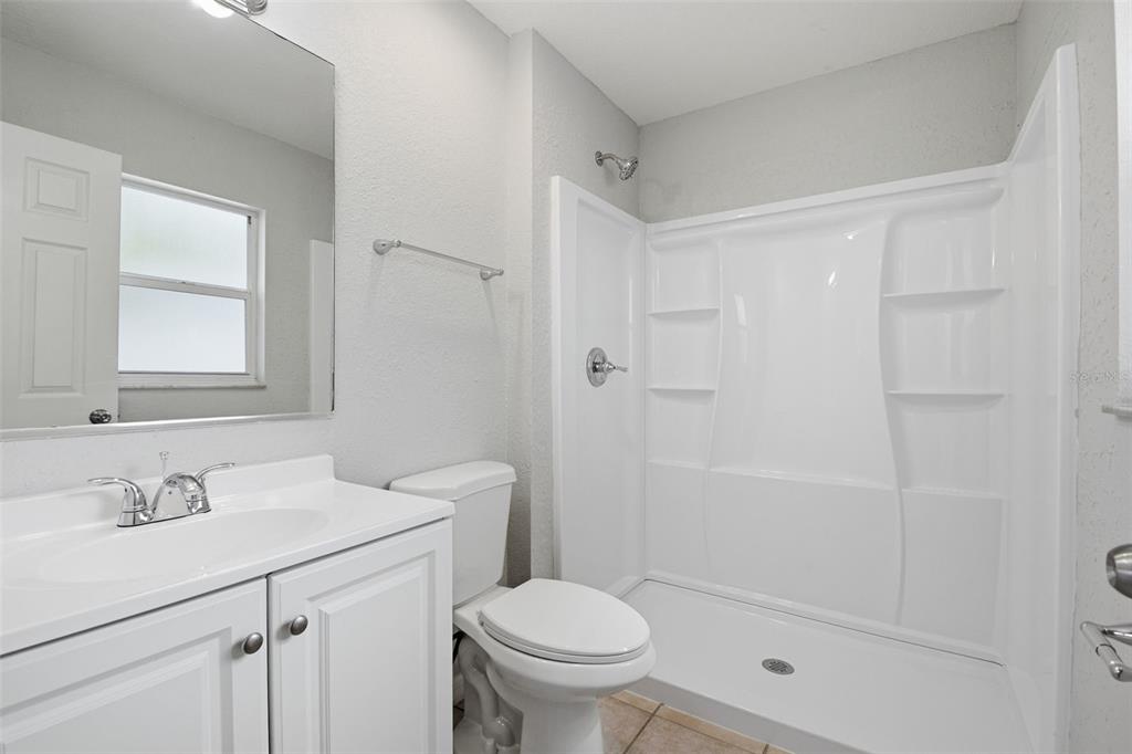 6018 Flora Terrace Apollo Beach, FL 33572 - Photo 27 of 33 a bathroom with a sink toilet and vanity