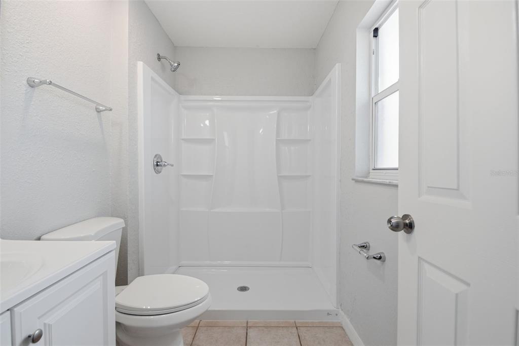 6018 Flora Terrace Apollo Beach, FL 33572 - Photo 28 of 33 a bathroom with a shower a toilet and a sink