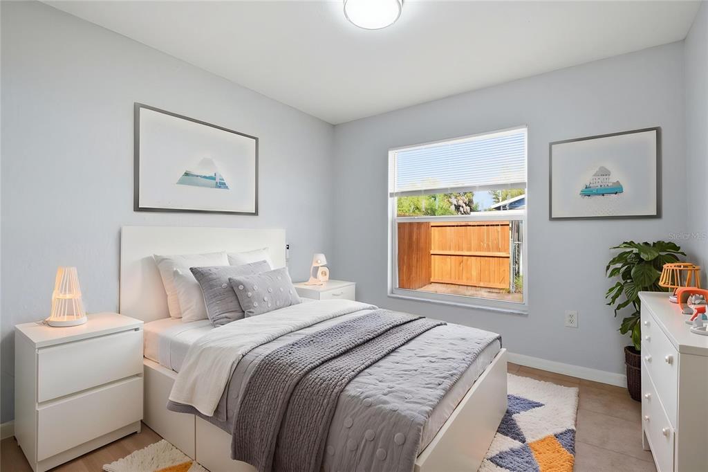 6018 Flora Terrace Apollo Beach, FL 33572 - Photo 6 of 33 a bedroom with a bed and a window