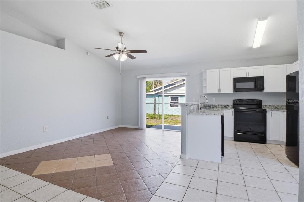 6018 Flora Terrace Apollo Beach, FL 33572 - Photo 10 of 33 a kitchen with a stove a sink and a refrigerator