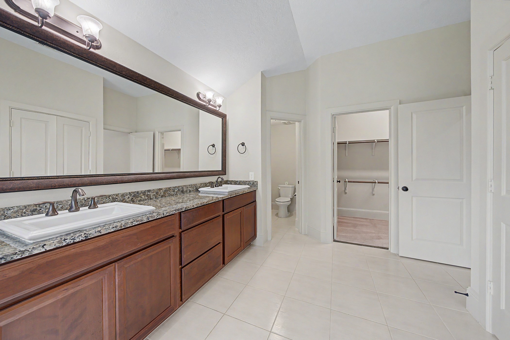 31032 Sunfall Trail Lane Spring, TX 77386 - Photo 17 of 39 a spacious bathroom with a granite countertop sink mirror and