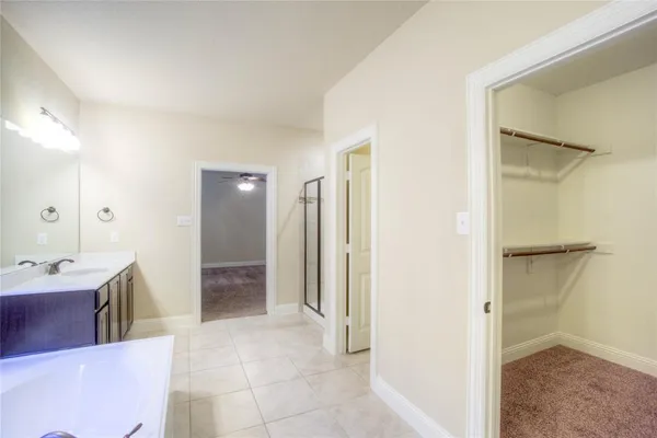 a view of a bathroom with a tub shower and a sink