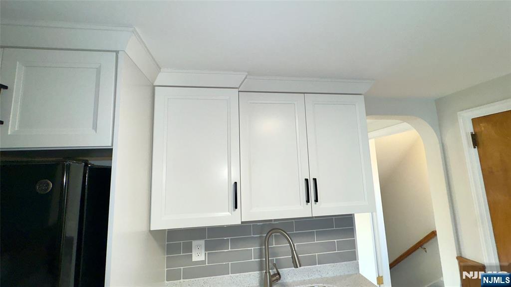 163 Center Street, Unit 2 New Milford, NJ 07646 - Photo 21 of 25 a bathroom with a shower and a mirror