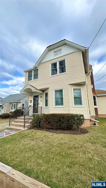 163 Center Street, Unit 2 New Milford, NJ 07646 - Photo 25 of 25 a front view of a house with a yard