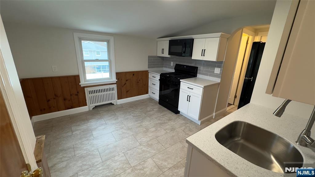 163 Center Street, Unit 2 New Milford, NJ 07646 - Photo 9 of 25 a kitchen with a refrigerator stove and sink
