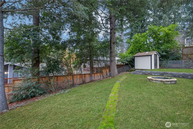 an aerial view of a house with a yard and garden