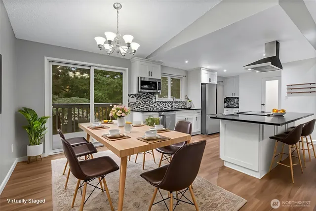 a view of a dining room with furniture window and wooden floor