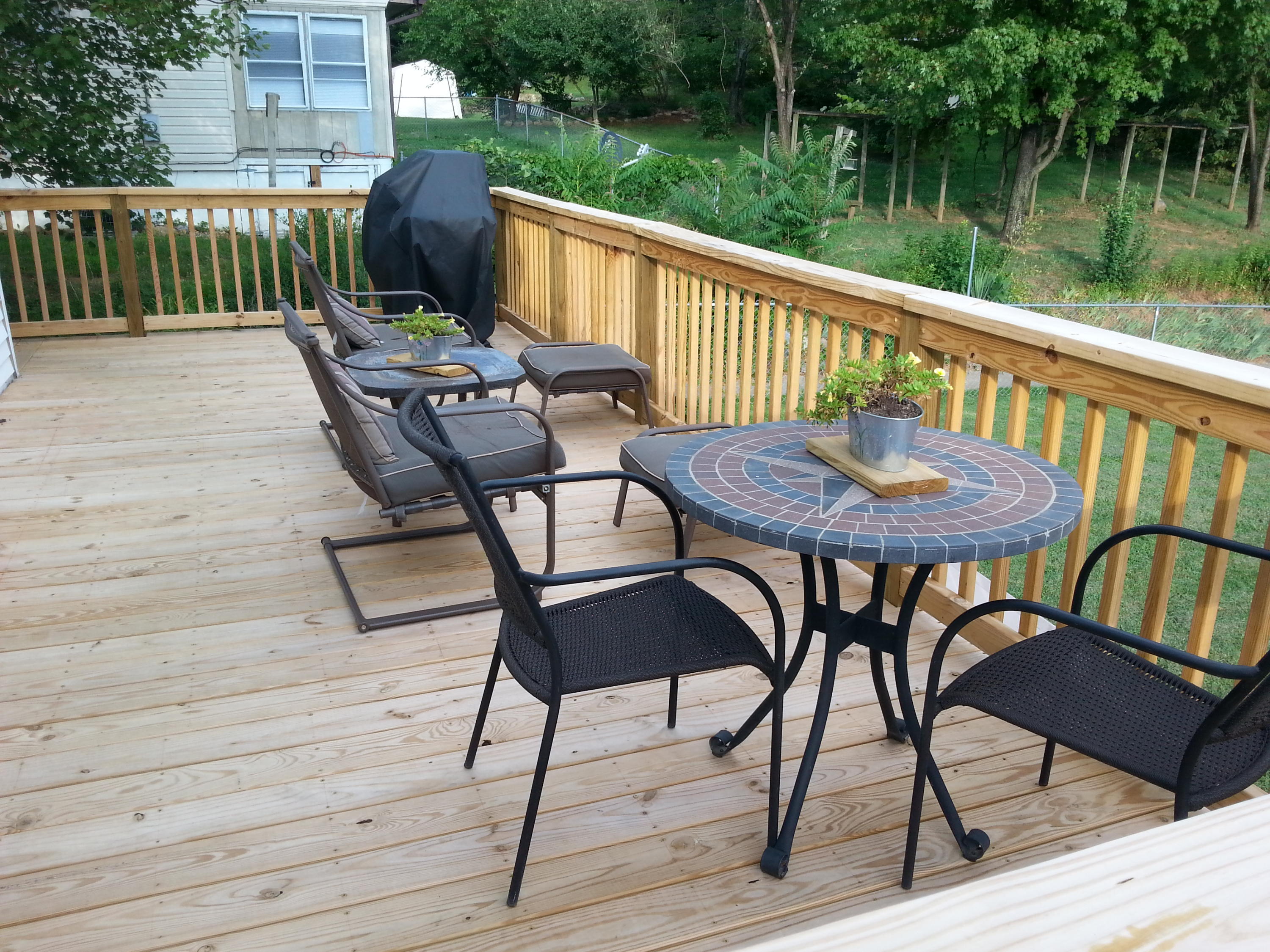 2021 Burma Road Salem, VA 24153 - Photo 11 of 13 a view of a chairs and table on the wooden deck