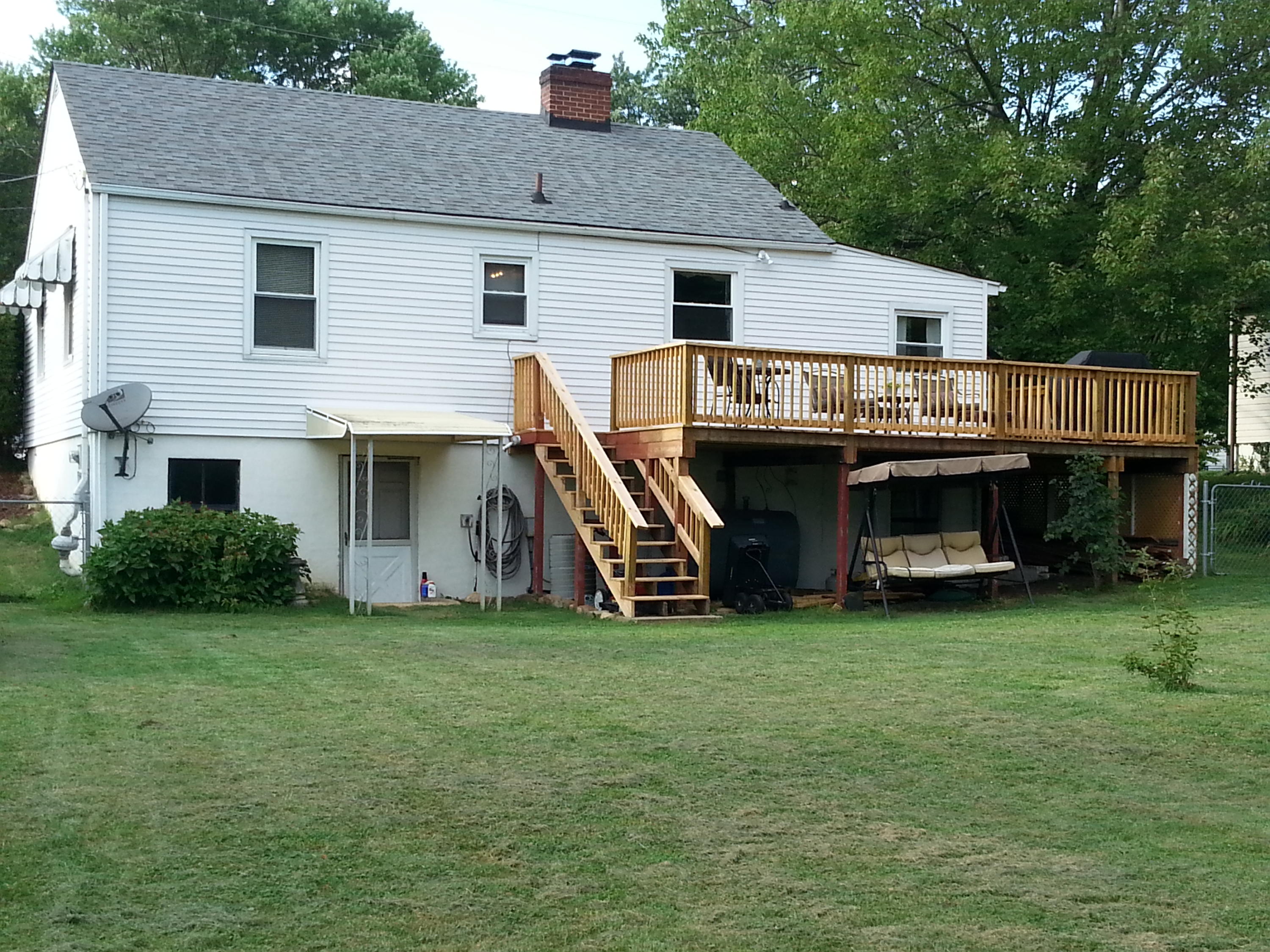2021 Burma Road Salem, VA 24153 - Photo 12 of 13 a view of a house with a yard and deck