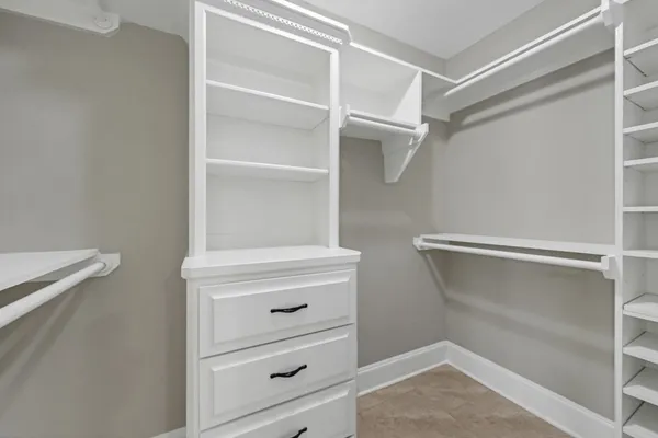a view of an empty walk in closet