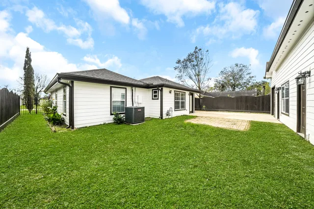 a backyard of a house with lots of green space