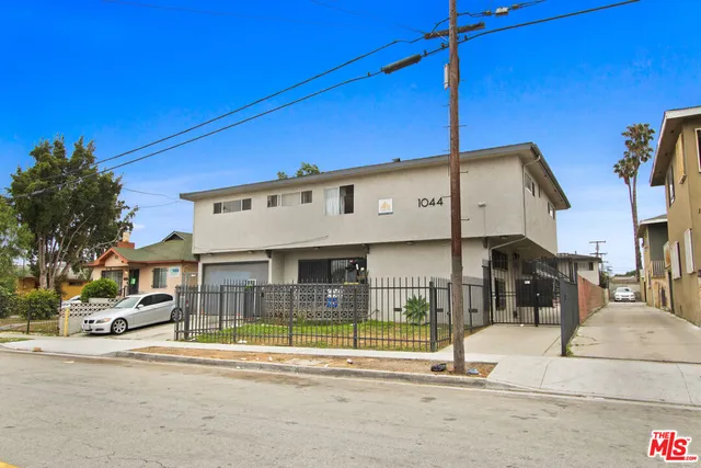 a view of a building with sitting area