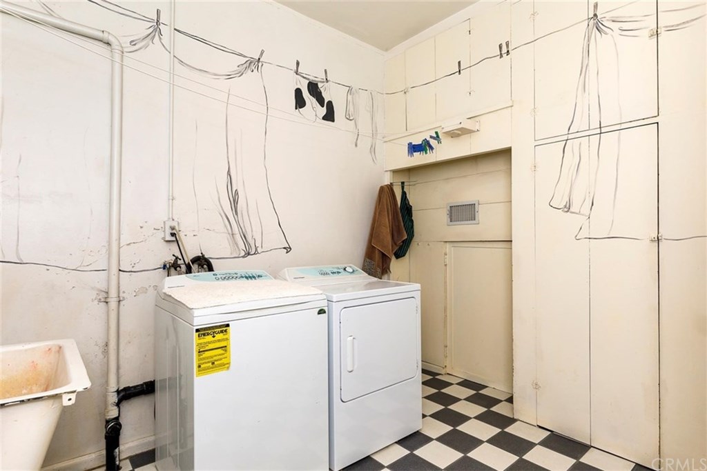 4670 Ladera Lane Riverside, CA 92501 - Photo 36 of 63 Large laundry with attic access and door to outside private little patio. Cabinets galore too