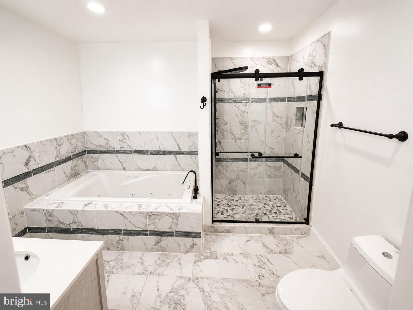 1610 Federal Street Baltimore, MD 21213 - Photo 12 of 27 Elegant marble bathroom retreat.