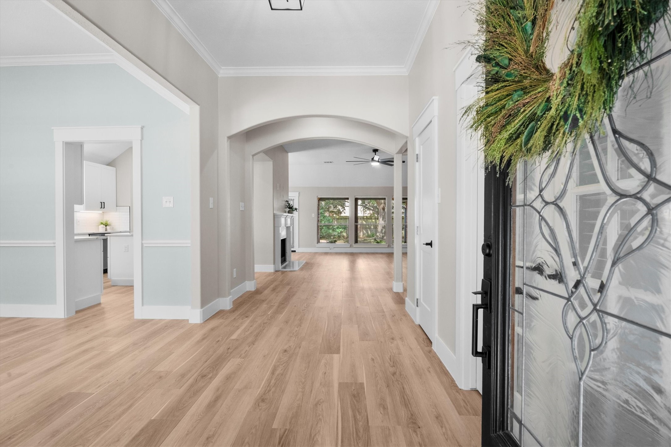 30111 Granum Drive Spring, TX 77386 - Photo 9 of 45 a view of a hallway with wooden floor and a potted plant