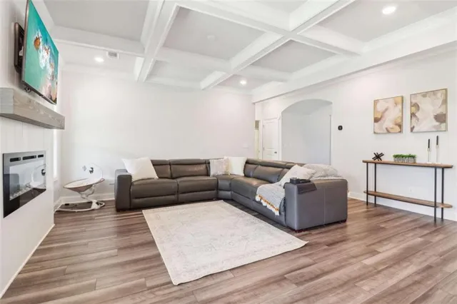 a view of a livingroom with furniture and a workspace