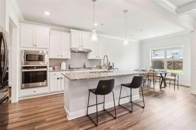 a bathroom with a sink a vanity and a mirror