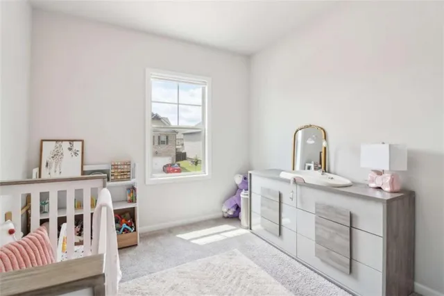 a en suite spacious bathroom with a double vanity sink a mirror and a shower