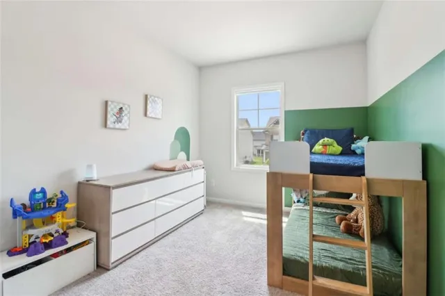 a view of a workspace with furniture and wooden floor