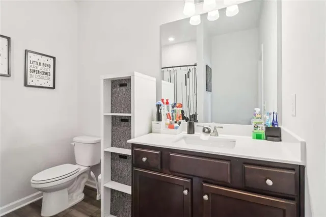 a bedroom with a bed and flat screen tv