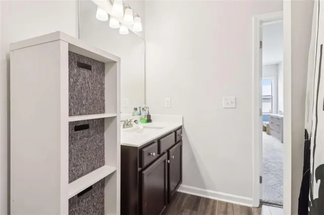 a living room with furniture and a glass door