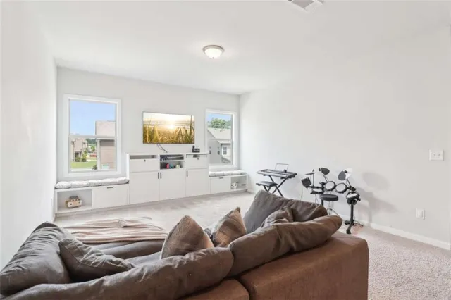 a view of a house with a yard and sitting area