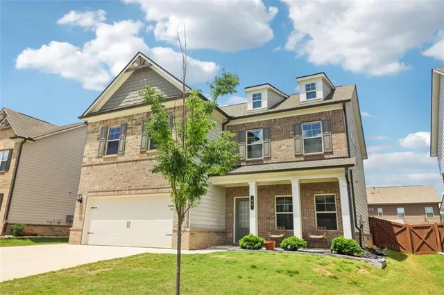 a view of a workspace with furniture and wooden floor