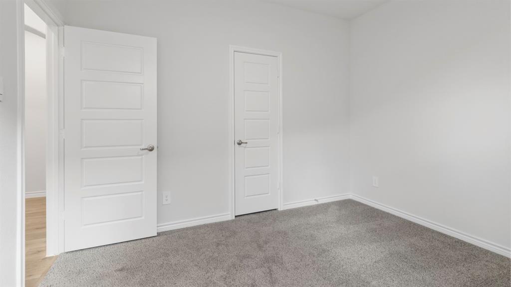 510 Range Road Caddo Mills, TX 75135 - Photo 6 of 25 Unfurnished bedroom with carpet and baseboards