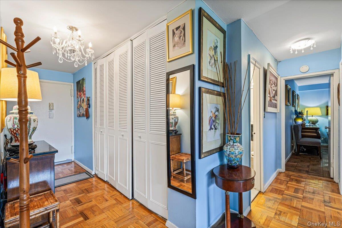 17-85 215th Street, Unit 1E Queens, NY 11360 - Photo 8 of 34 a view of an entryway and livingroom with furniture