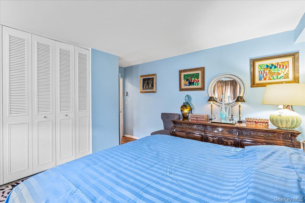 17-85 215th Street, Unit 1E Queens, NY 11360 - Photo 10 of 34 a bed room with a bed