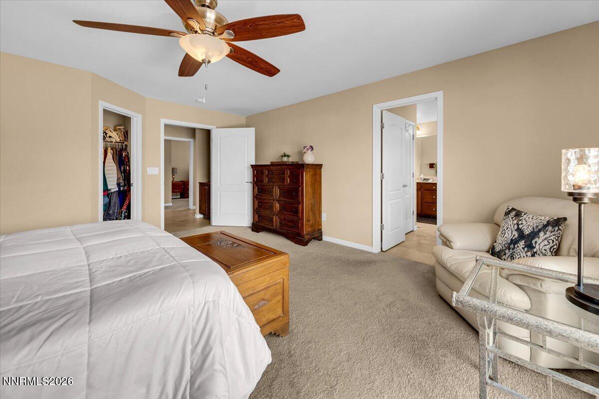 104 Bethpage Road Dayton, NV 89403 - Photo 25 of 65 a bedroom with a bed dresser and a window