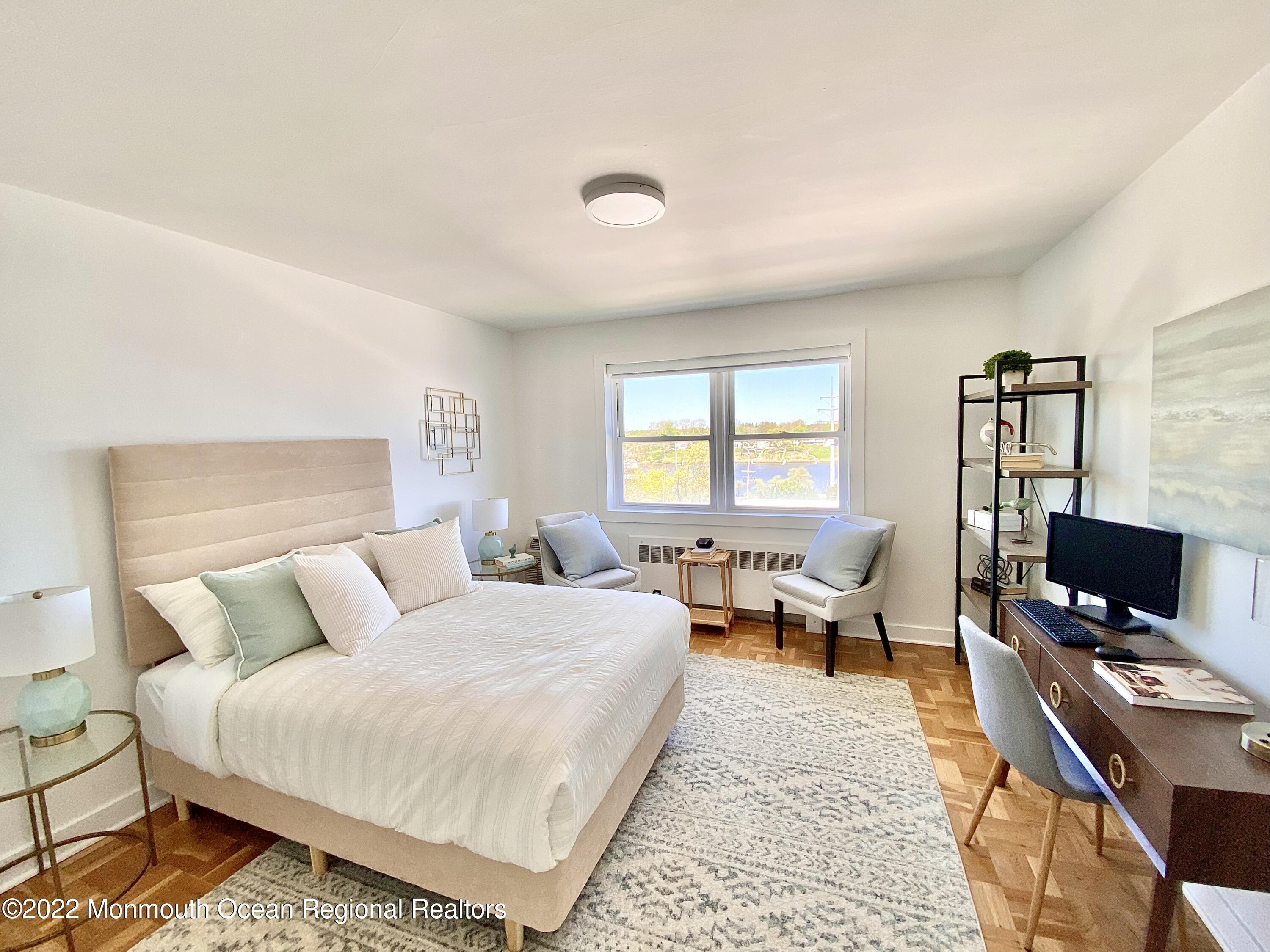 122 Bodman Place Red Bank, NJ 07701 - Photo 17 of 22 a bedroom with a bed and wooden floor