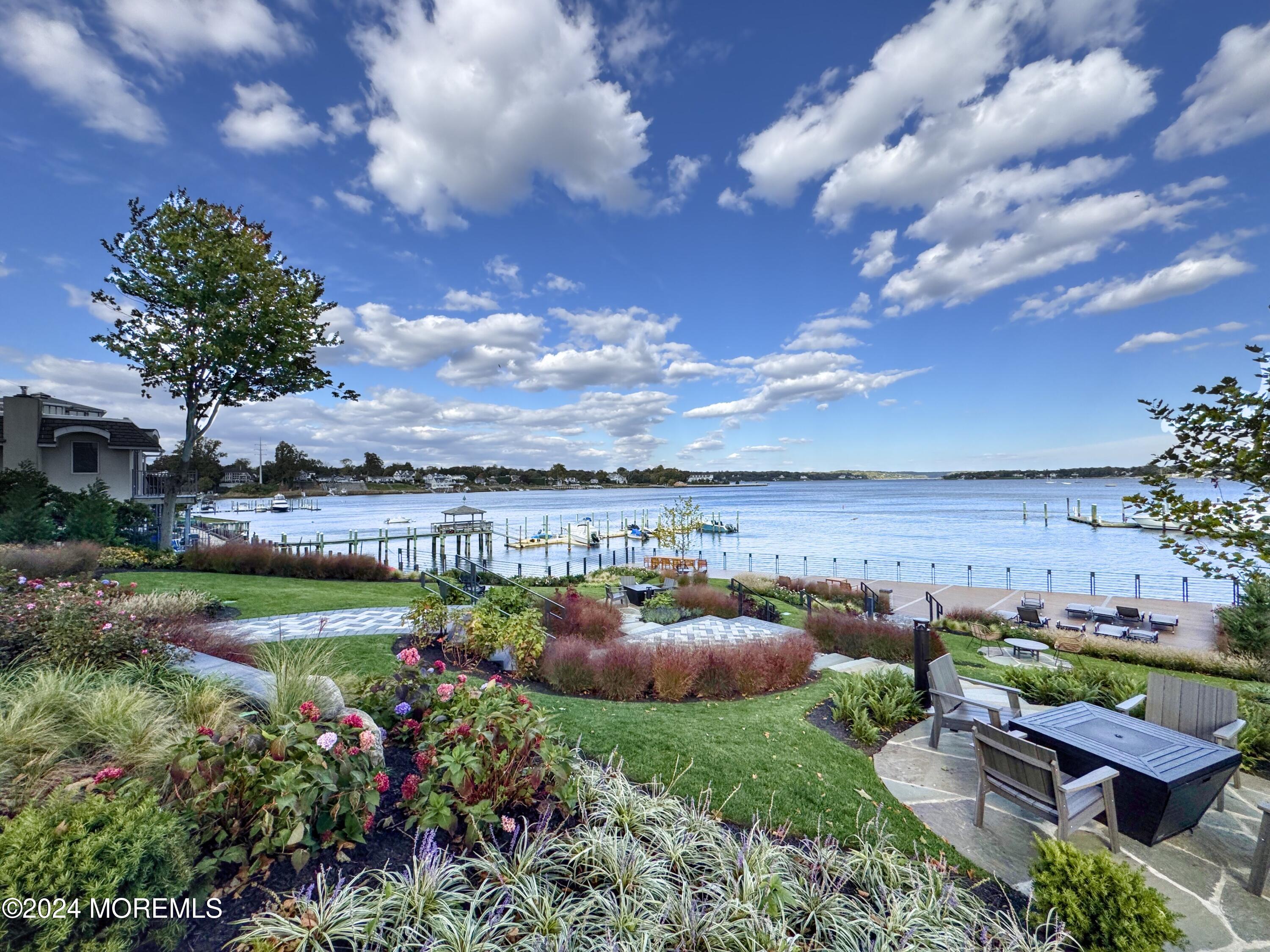 122 Bodman Place Red Bank, NJ 07701 - Photo 3 of 22 a view of a garden with lawn chairs