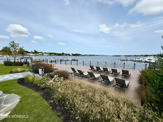 a picture of a lake with outdoor seating