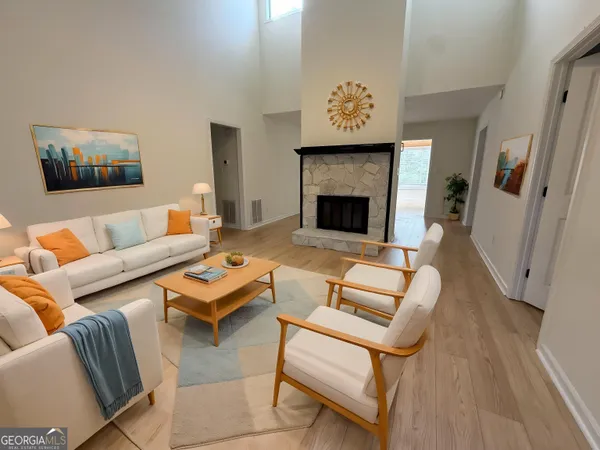 a living room with furniture and a fireplace
