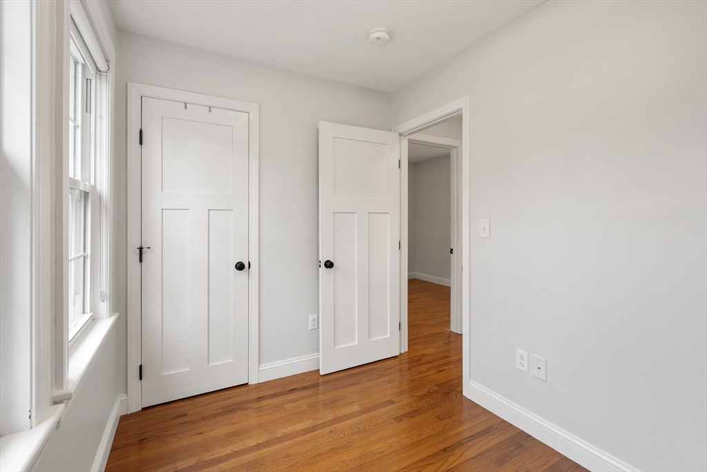 166 Parker Street, Unit 4 Maynard, MA 01754 - Photo 26 of 37 a view of hallway with wooden floor