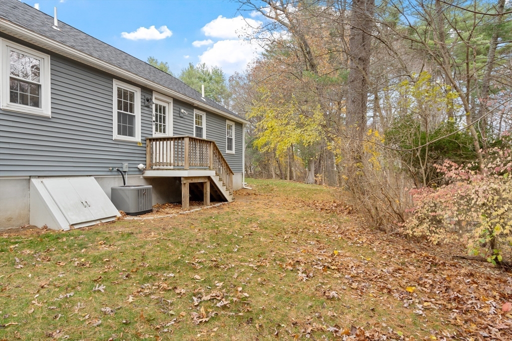 166 Parker Street, Unit 4 Maynard, MA 01754 - Photo 30 of 37 a front view of a house with a yard