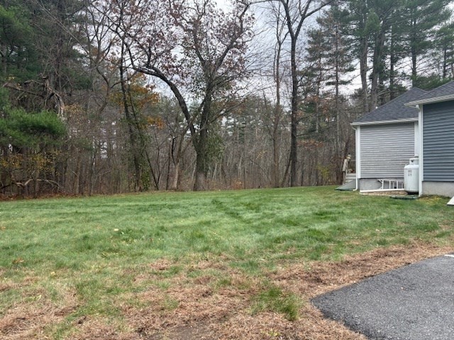 166 Parker Street, Unit 4 Maynard, MA 01754 - Photo 35 of 37 a backyard of a house with lots of green space