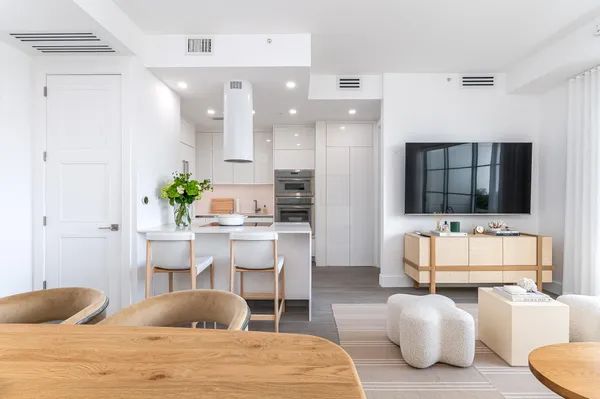 a bedroom with furniture and a flat screen tv