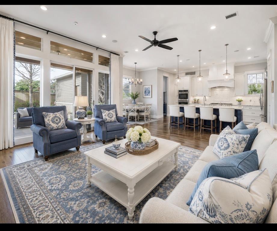 AI Image Open concept living space featuring wood-finish flooring, recessed lighting, and a ceiling fan