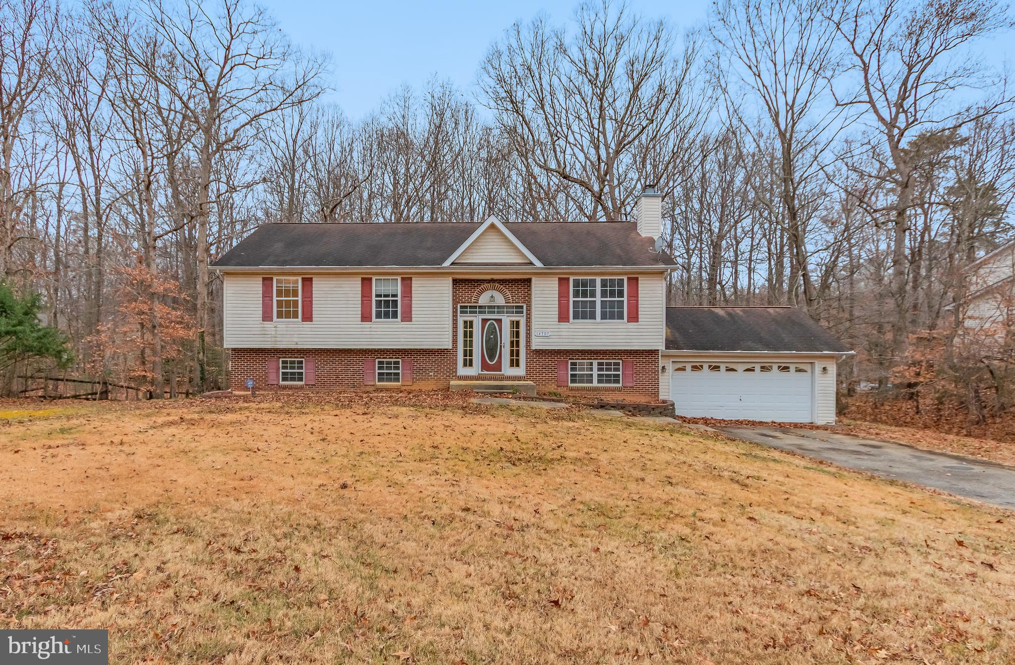 14107 Kydon Court Brandywine, MD 20613 - Photo 1 of 27 a front view of a house with a garden and tree