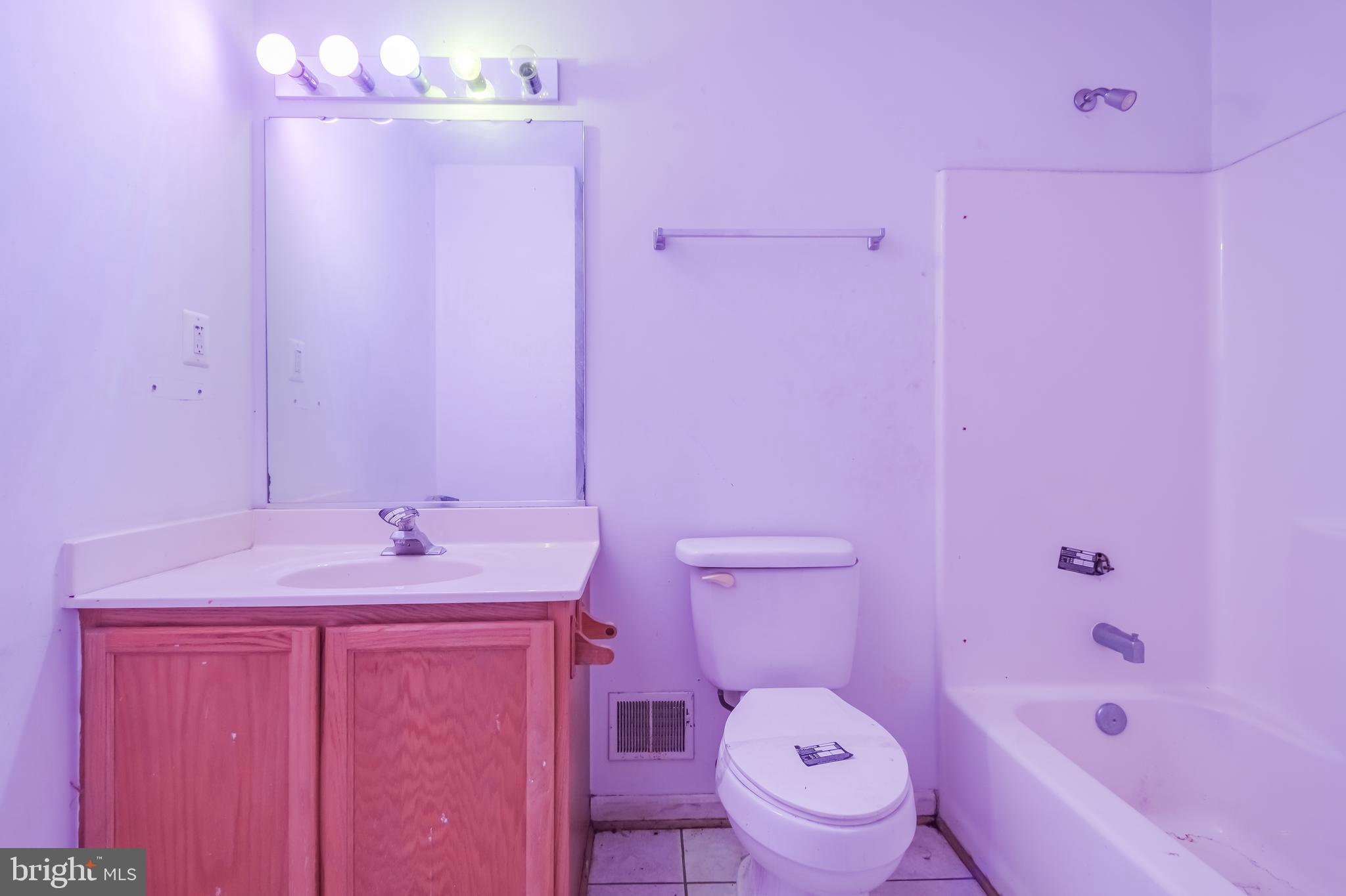 14107 Kydon Court Brandywine, MD 20613 - Photo 11 of 27 a bathroom with a sink a toilet and shower