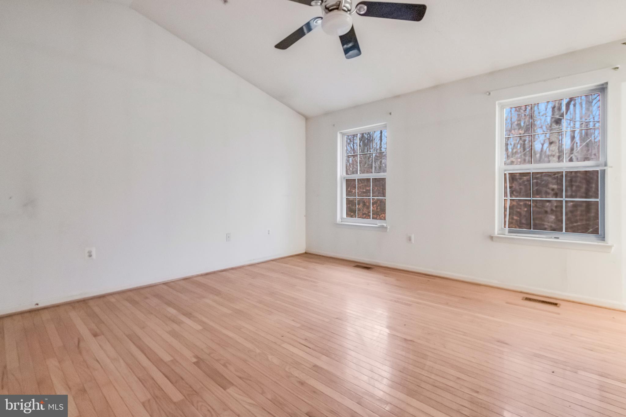14107 Kydon Court Brandywine, MD 20613 - Photo 13 of 27 a view of an empty room with a window and wooden floor