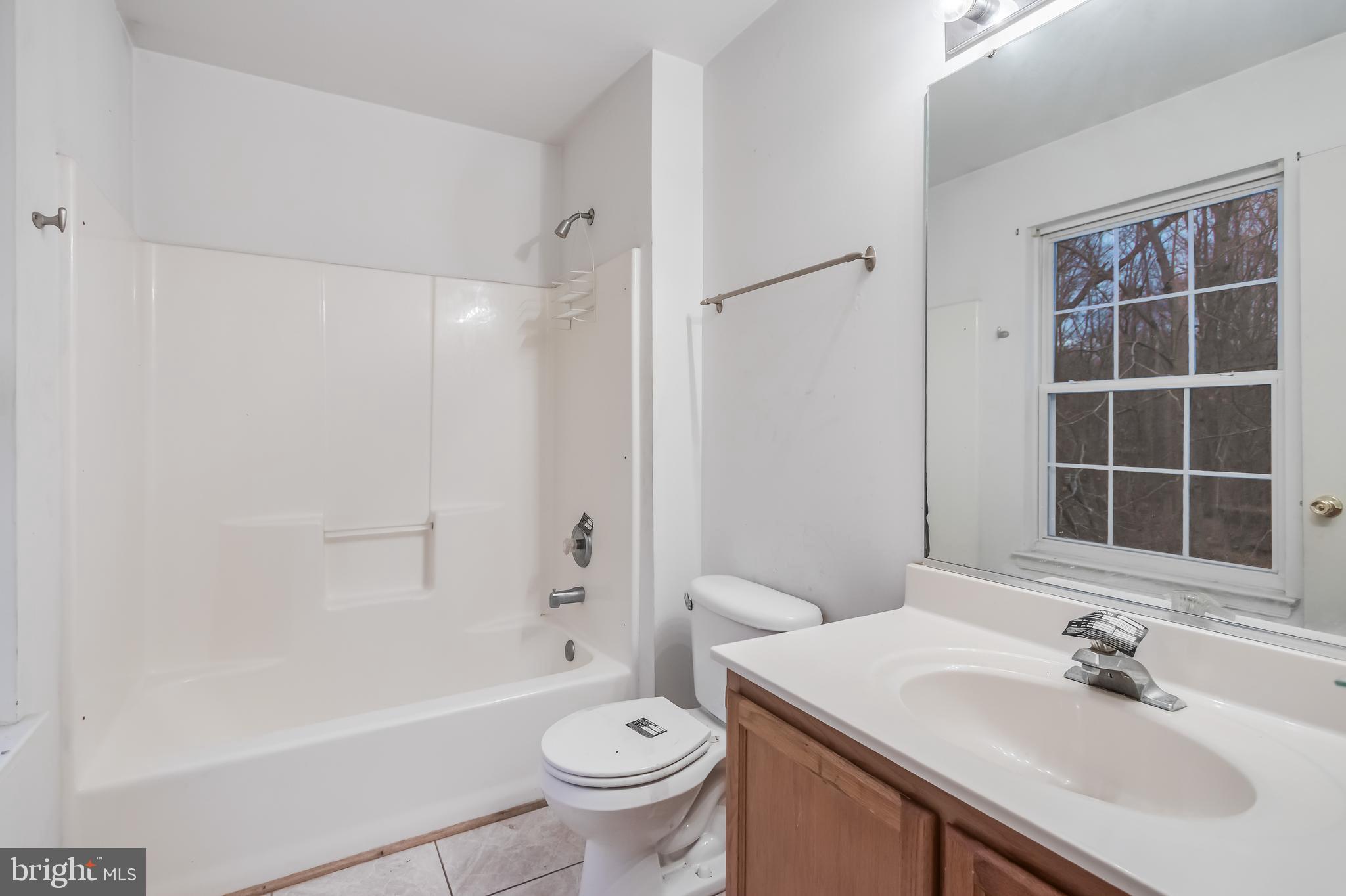 14107 Kydon Court Brandywine, MD 20613 - Photo 15 of 27 a bathroom with a sink toilet and shower