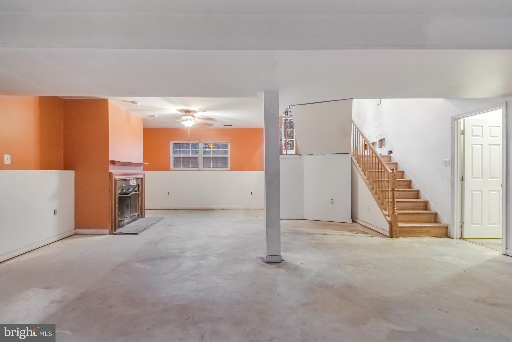 14107 Kydon Court Brandywine, MD 20613 - Photo 19 of 27 a view of an empty room with stairs and furniture