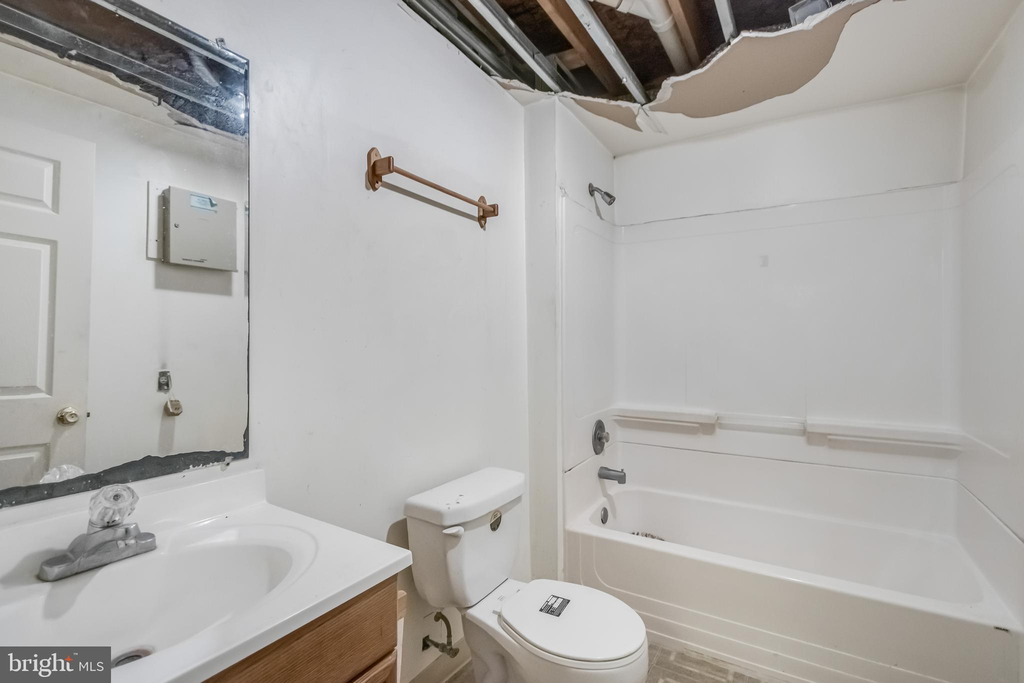 14107 Kydon Court Brandywine, MD 20613 - Photo 22 of 27 a bathroom with a sink a toilet and shower