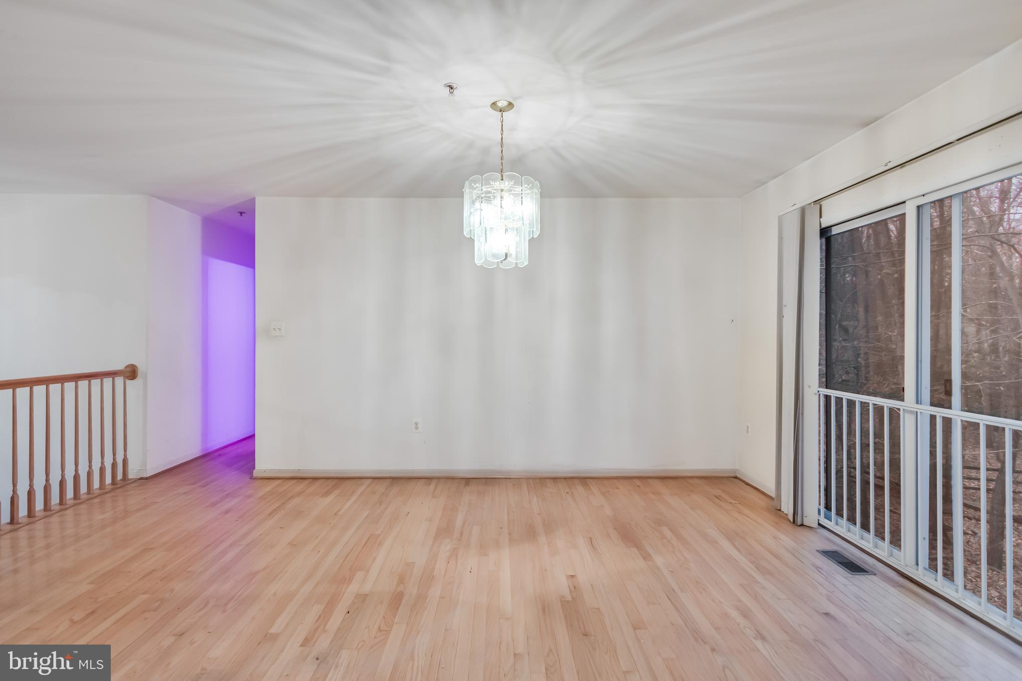 14107 Kydon Court Brandywine, MD 20613 - Photo 6 of 27 an empty room with wooden floor and windows