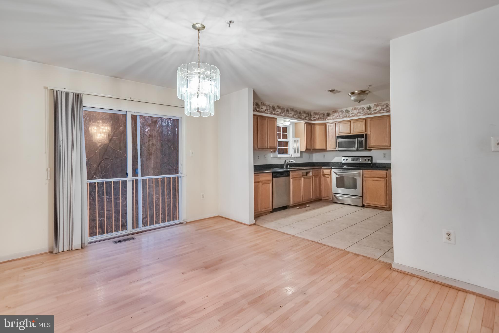 14107 Kydon Court Brandywine, MD 20613 - Photo 7 of 27 a view of a kitchen with stainless steel appliances granite countertop a stove and cabinets