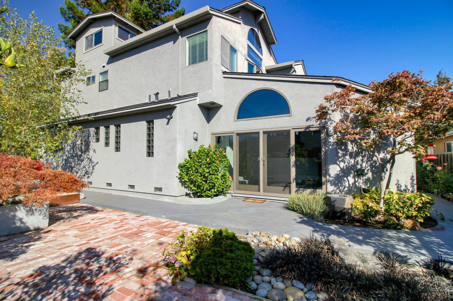 5998 Sutton Park Place Cupertino, CA 95014 - Photo 5 of 6 a front view of a house with a yard